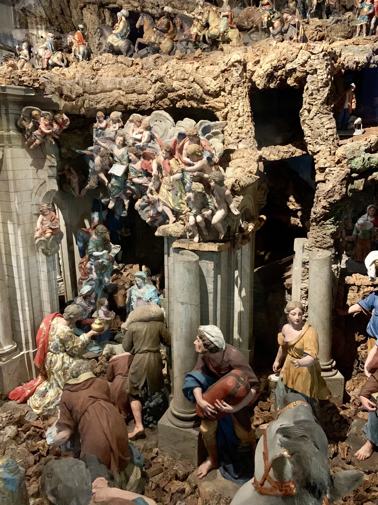 Terracotta figures arranged within the elaborate Nativity scene at Basílica da Estrela