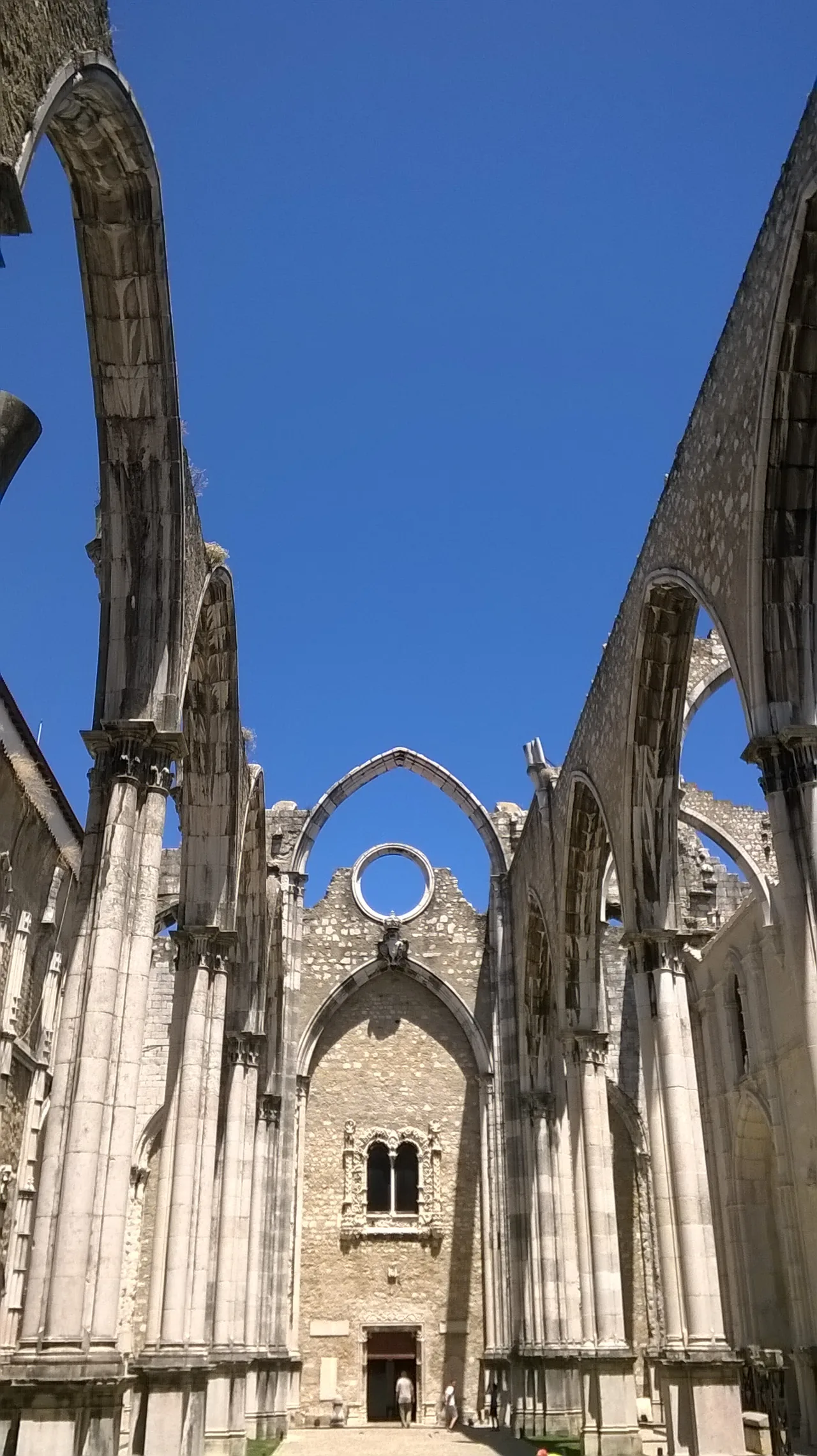 The tall columns and pointed arches of Carmo’s roofless church.
