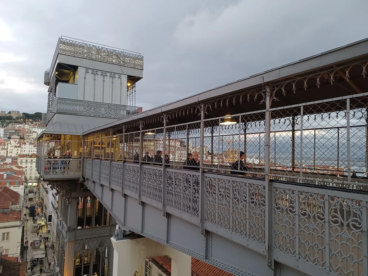 Santa Justa Lift and its covered iron bridge beside the rooftops of Baixa.