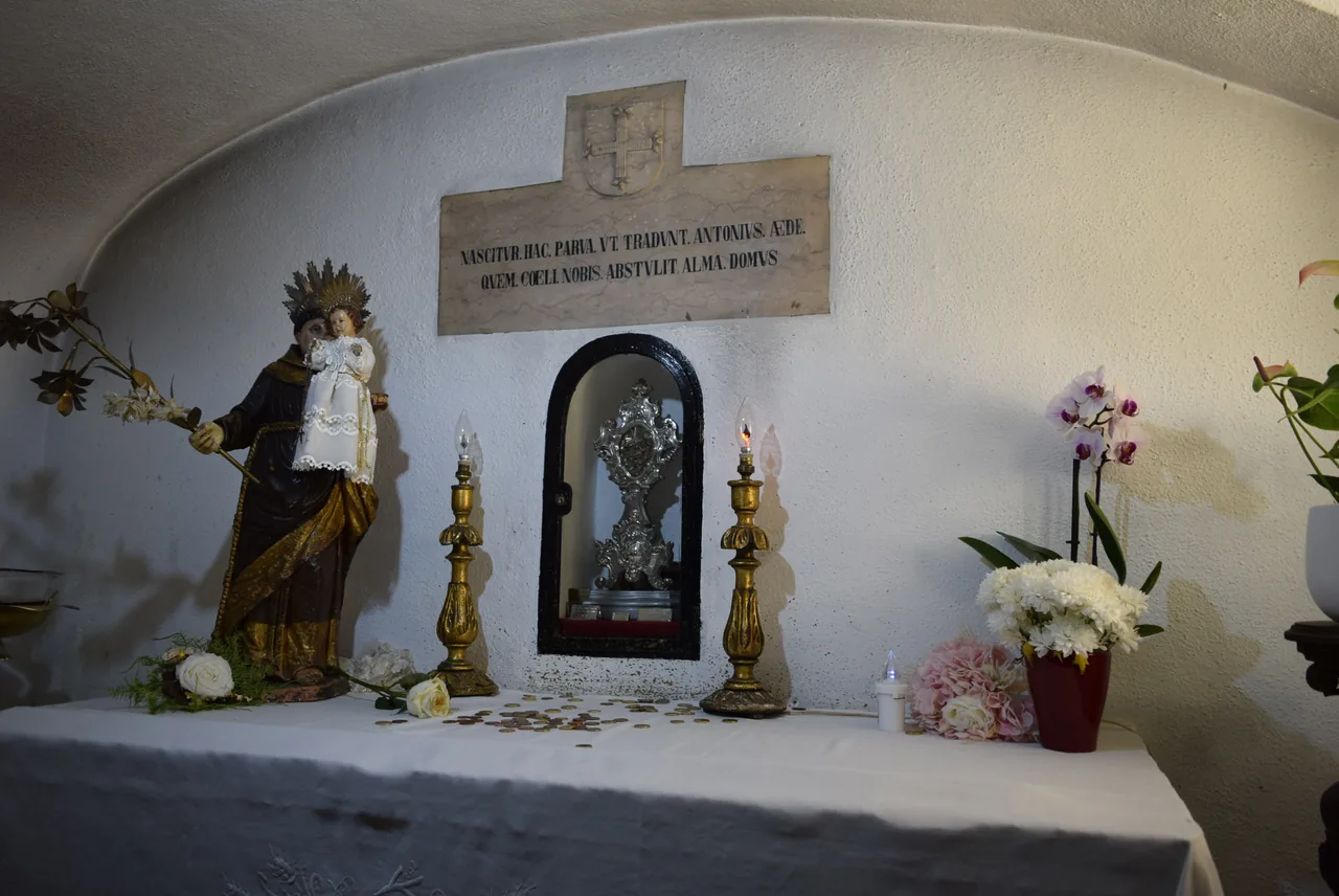 Small altar and devotional figures in the crypt of St Anthony’s Church