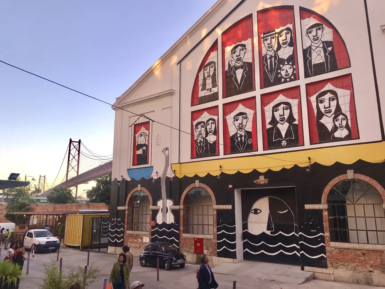 Painted portraits on the façades of the former factory buildings at LX Factory.