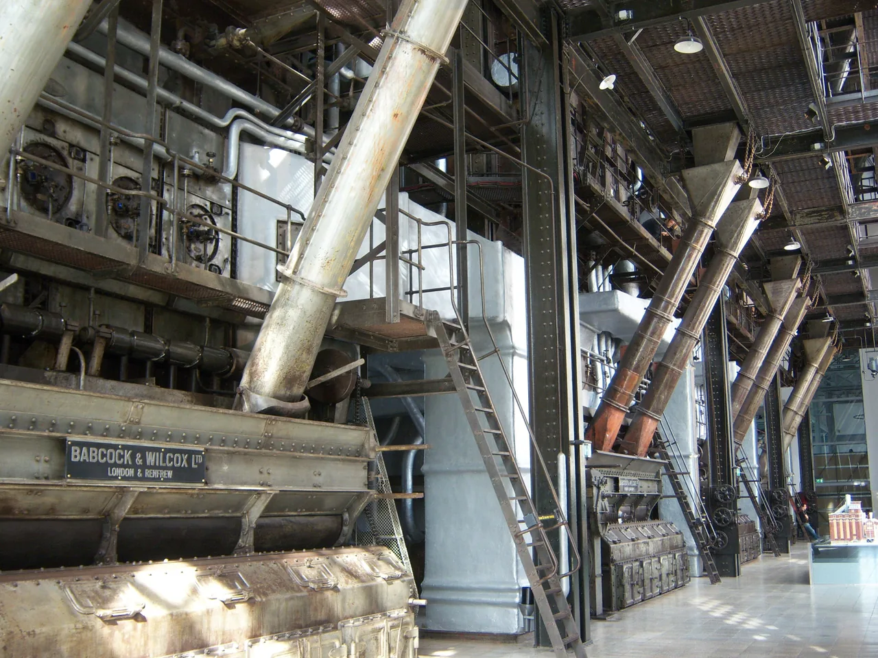 Large boilers, pipes and metal walkways inside the former Central Tejo power station.