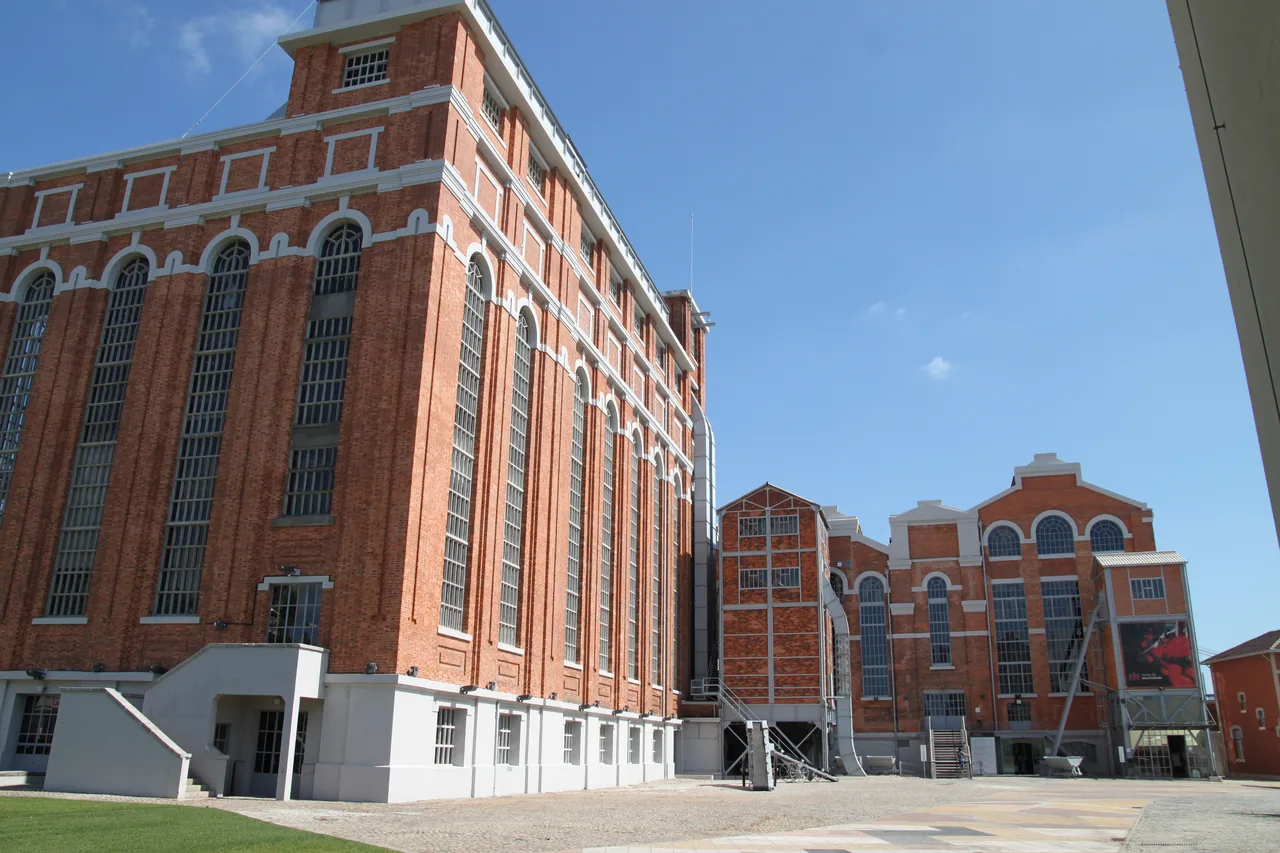 Tall brick façades and industrial windows at Central Tejo.