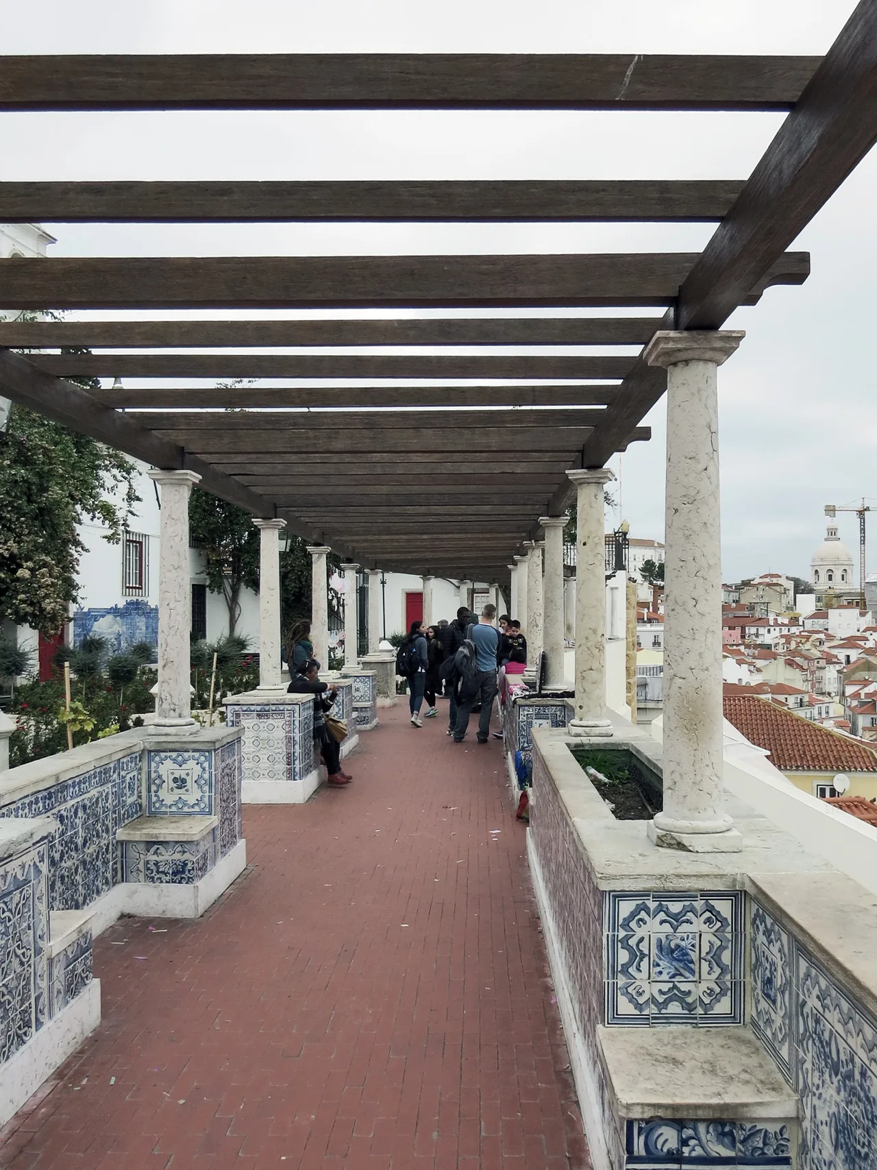 The pergola and tiled terrace at Santa Luzia overlooking Alfama.