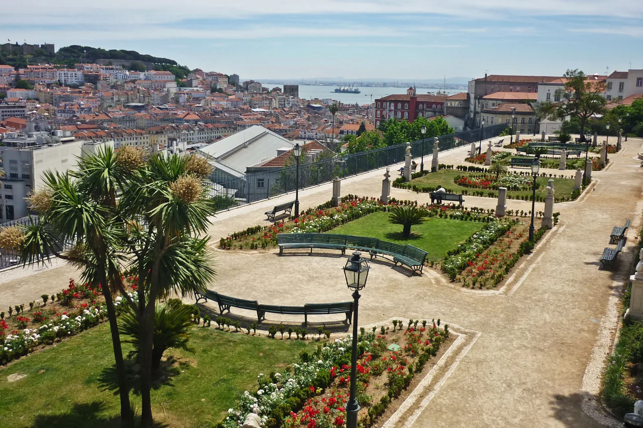 The formal lower garden at São Pedro de Alcântara with Lisbon’s hills beyond.