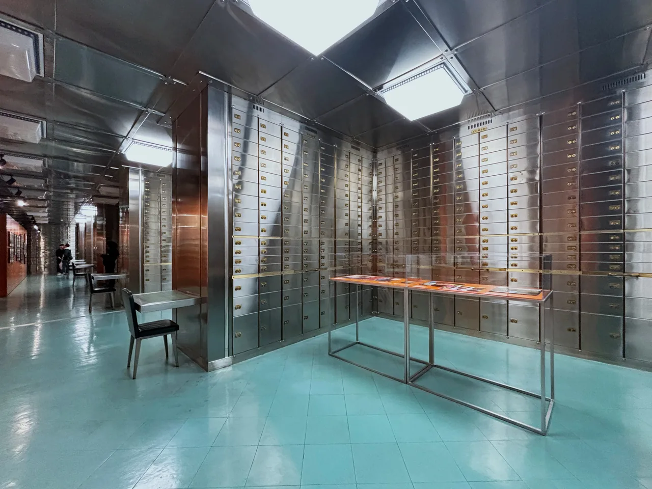 Metal safe-deposit boxes lining the basement gallery at MUDE