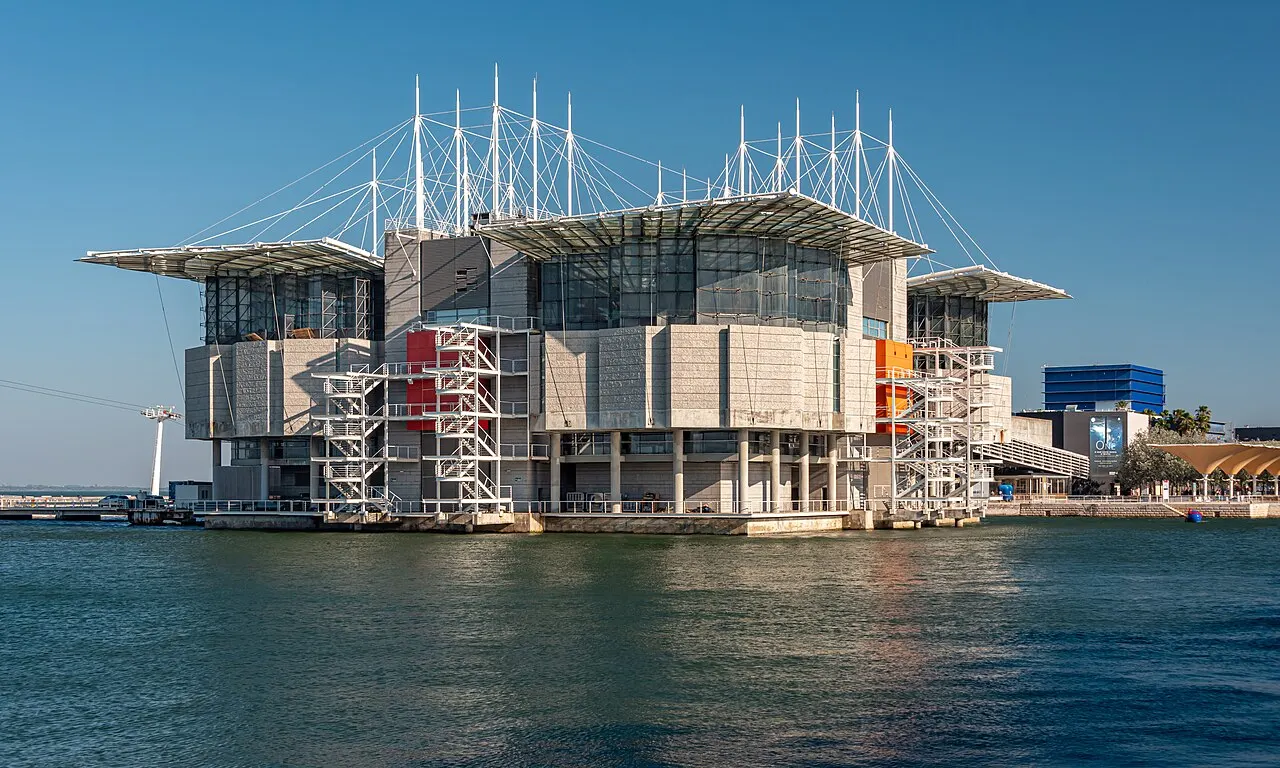 Lisbon Oceanarium’s glass and stone building standing beside the water.