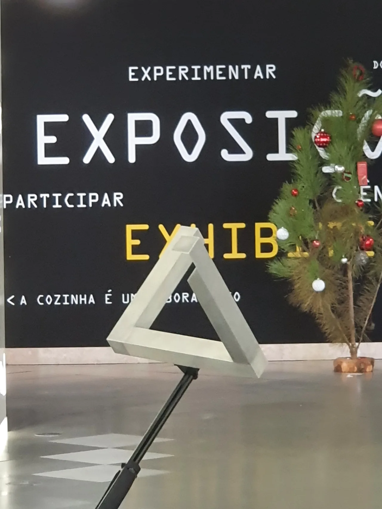 White triangular optical illusion displayed inside Pavilhão do Conhecimento