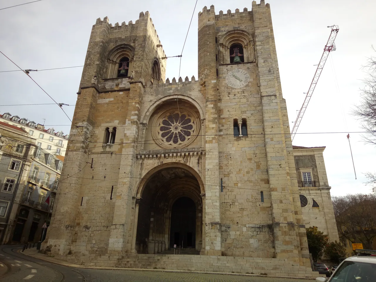 The twin stone towers, rose window and entrance of Lisbon Cathedral.